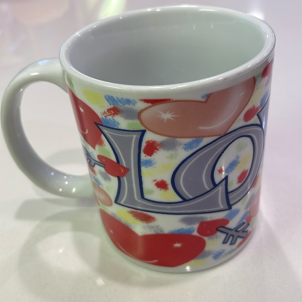 LOVE wrap around ceramic cup/mug.Standard 8 oz size. Microwave/dishwasher safe.